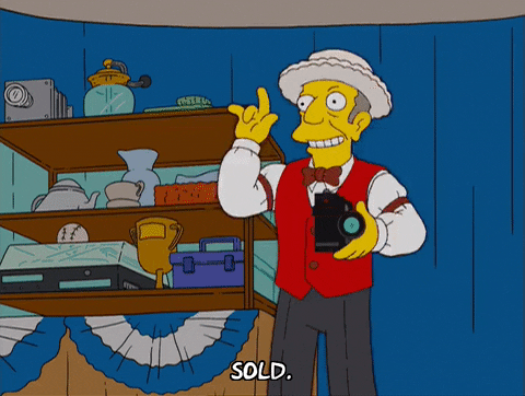 A GIF of Simpsons character Principal Skinner being an auctioneer and saying 'sold'.