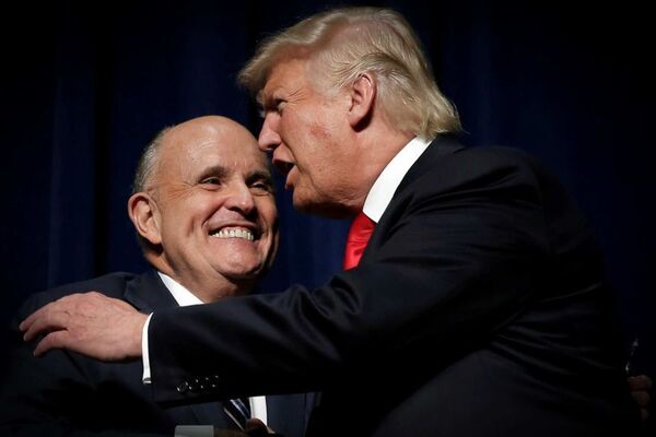 Donald Trump hugs his personal attorney Rudy Giuliani