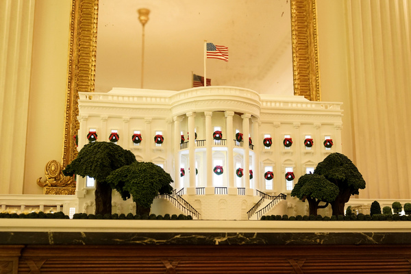 A gingerbread White House stands in the State Dining Room during the 2020 Christmas preview at the White House