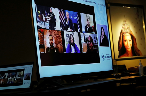 A video screen on display for members of the news media is seen featuring U.S. President-elect Joe Biden as he sits in a nearby room and participates in a video call with small business owners