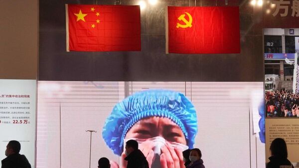 Wuhan residents attend an exhibition on the city's fight against the coronavirus