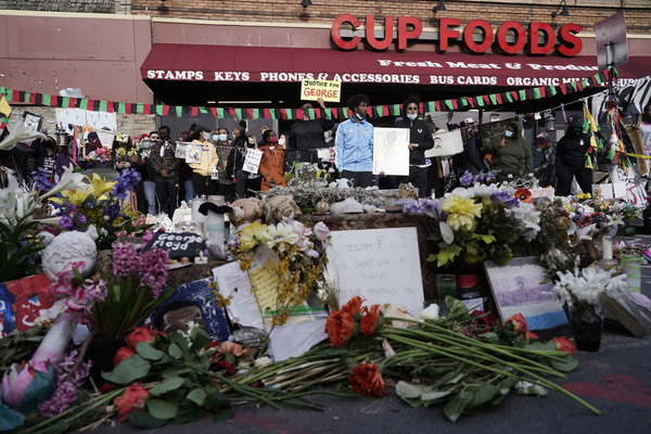 People gather at Cup Foods after a guilty verdict was announced at the trial of former Minneapolis police Officer Derek Chauvin for the 2020 death of George Floyd, Tuesday, April 20, 2021, in Minneapolis
