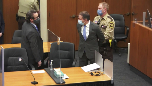 Derek Chauvin is handcuffed and escorted from the court room.